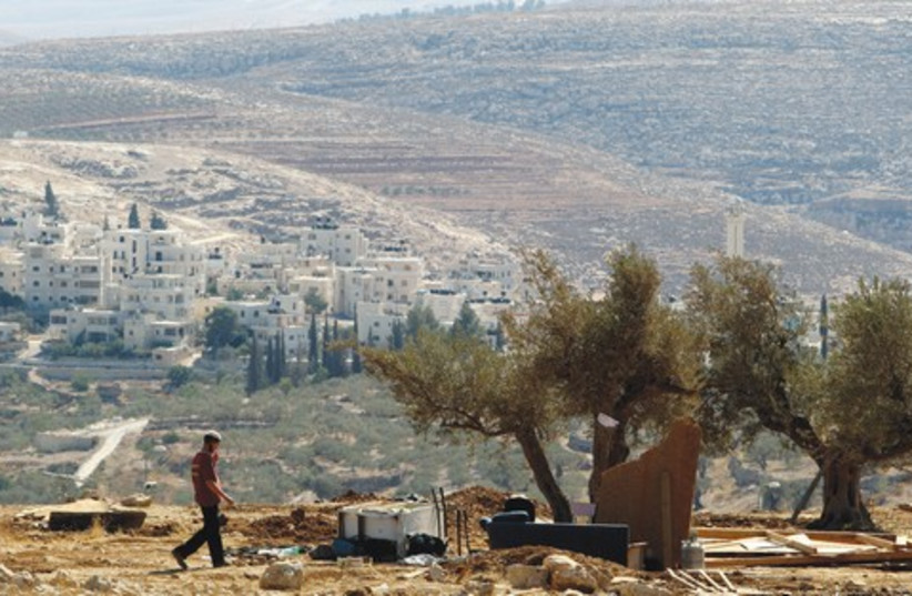 Settler in West Bank 521 (photo credit: Reuters)