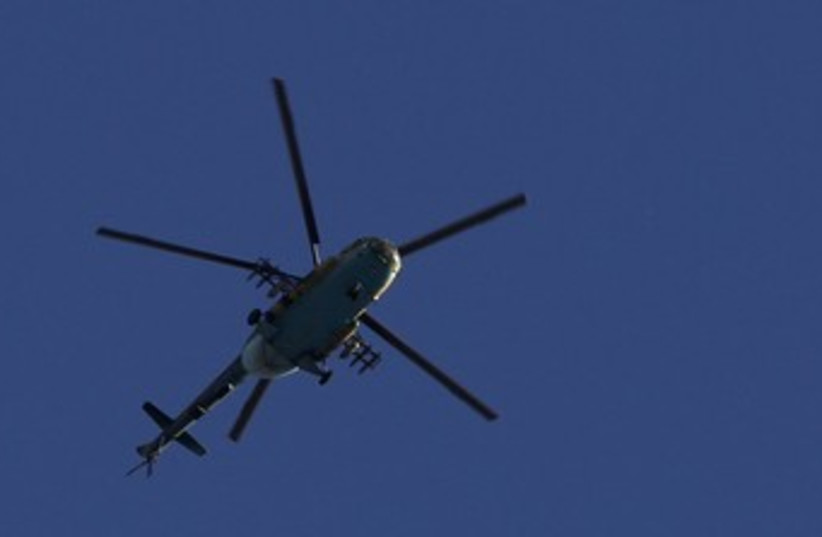 Syrian army helicopter prepares to fire missile 370 (photo credit: reuters)
