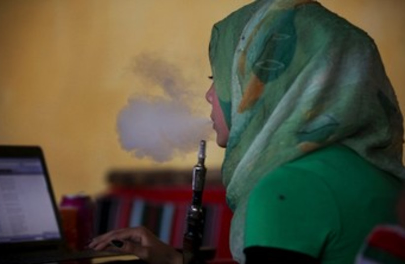 Woman smoking Shisha (370) (photo credit: Courtesy YaLa-Young Leaders)