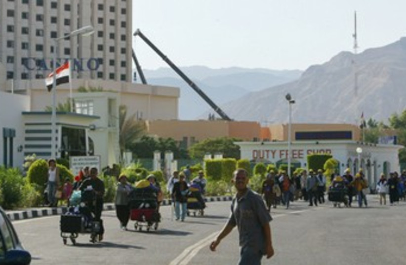 Tourists cross the Egypt-Israel Taba border crossing 370 (R) (photo credit: REUTERS)