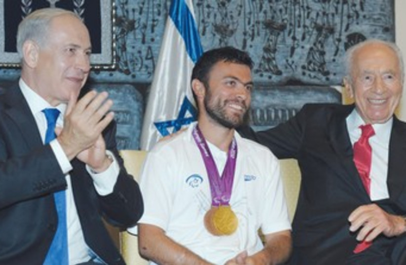 Paralympic tennis player Noam Gershony with Peres, PM 370 (photo credit: GPO)