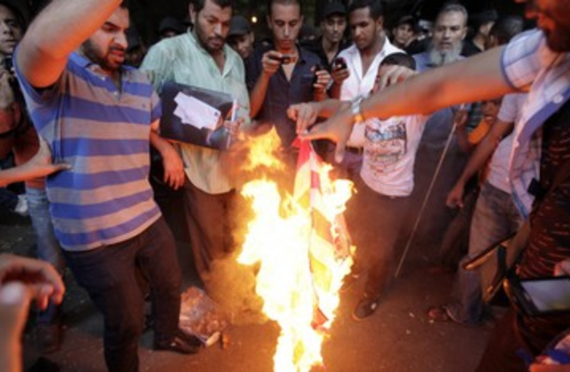 Egyptians protest at US embassy 390 (photo credit: Mohamed Abd El Ghany / Reuters)