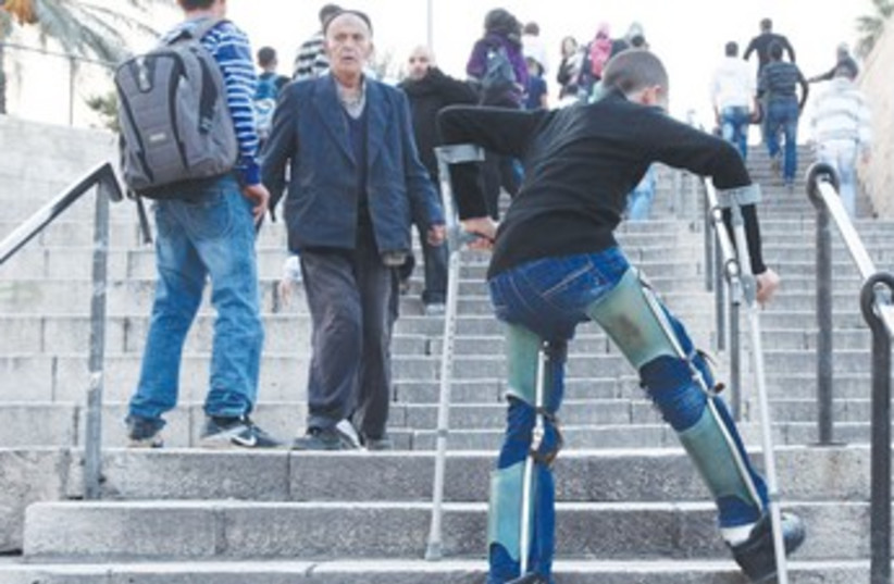 Disabled bot climbs stairs 370 (photo credit: Marc Israel Sellem/The Jerusalem Post)