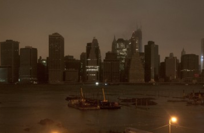 Dark Manhattan skyline in Hurricane Sandy 390 (photo credit: Keith Bedford / Reuters)
