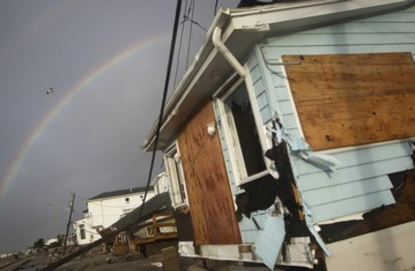 A rainbow is seen among homes devasted by Sandy 