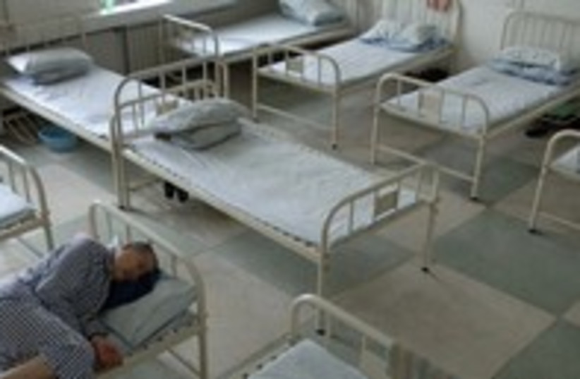 Mental health inmate rests in bed [illustrative] 300 (photo credit: REUTERS/Jianan Yu)