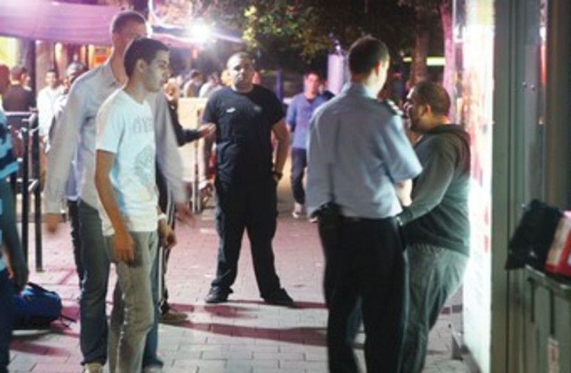 Police question youth outside club 370 (photo credit: Ben Hartman)