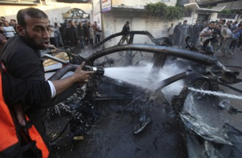 Car carrying Hamas commander Jabari hit by IDF 390 (photo credit: Reuters)