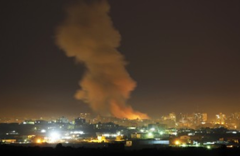 An Israeli air strike in the Gaza Strip 370 (R) (photo credit: REUTERS/Amir Cohen)