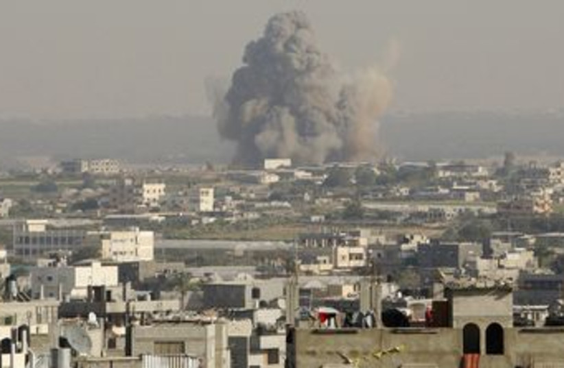 Smoke from explosion in Gaza Strip [file] (photo credit: Ibraheem Abu Mustafa / Reuters)
