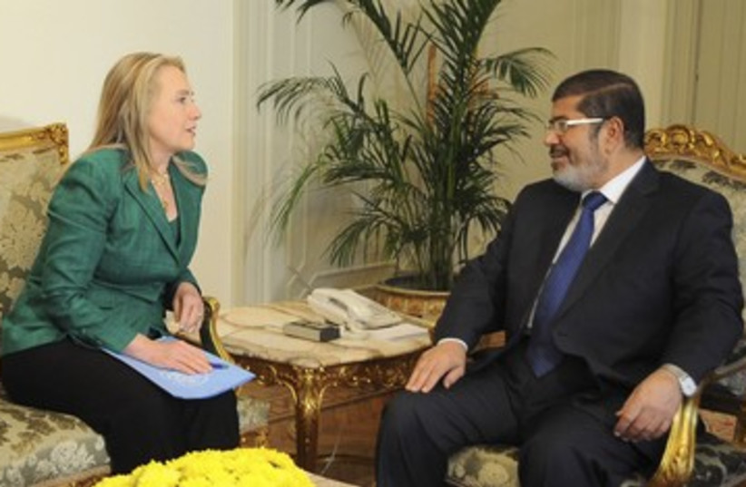 Morsi and Clinton 390 (photo credit: REUTERS)