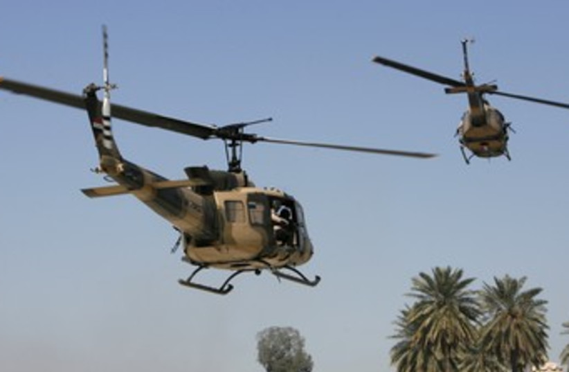 Iraqi Air Force Huey II helicopters [illustrative] 370 (photo credit: REUTERS/Erik de Castro)