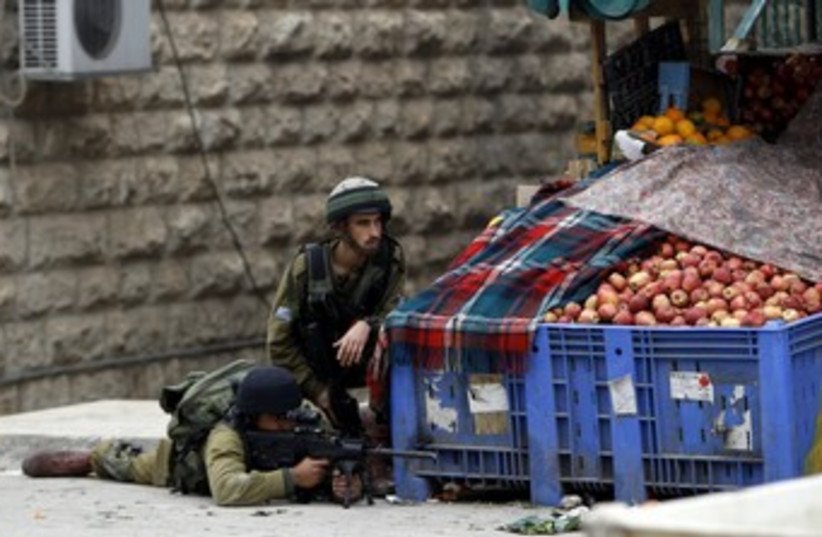 IDF soldiers in Hebron 370 (photo credit: REUTERS/Ammar Awad)