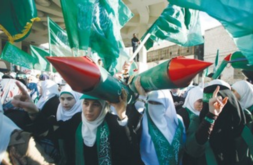 PALESTINIAN WOMEN pose at Hamas rally 370 (photo credit: Muammar Awad/Reuters)
