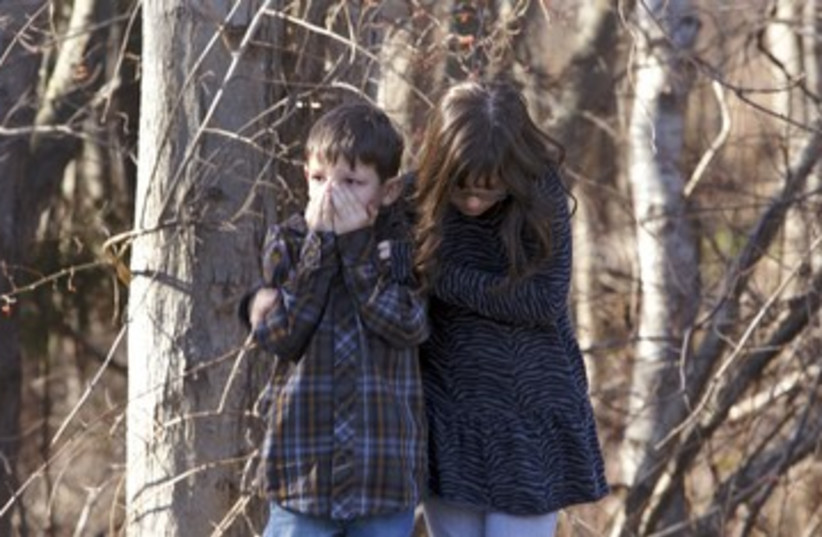 Shocked children after Connecticut school shooting 390 (photo credit: Michelle McLoughlin / Reuters)