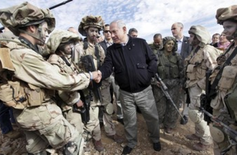 Netanyahu shakes hands with IDF soldiers 370 (photo credit: REUTERS/POOL New)