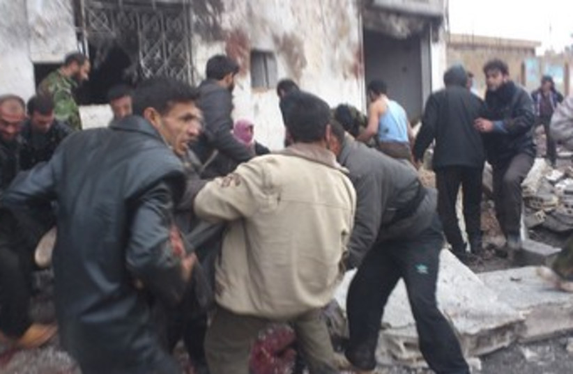 The scene of a bombing on bakery in Syria 370 (photo credit: REUTERS/Handout .)