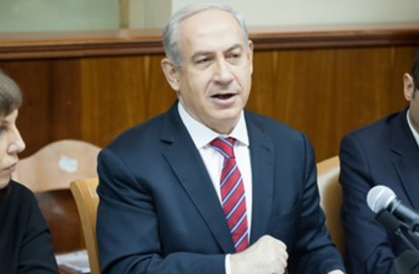 PM Netanyahu at cabinet meeting 370 (R) (photo credit: Pool / Emil Zalman / Haaretz)