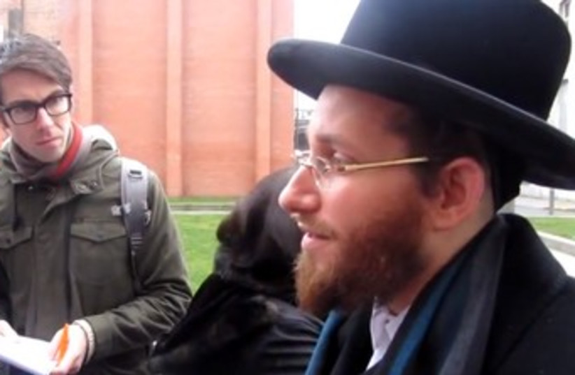 Moshe Aryeh Friedman speaks to reporters in Belgium 370 (photo credit: Screenshot)