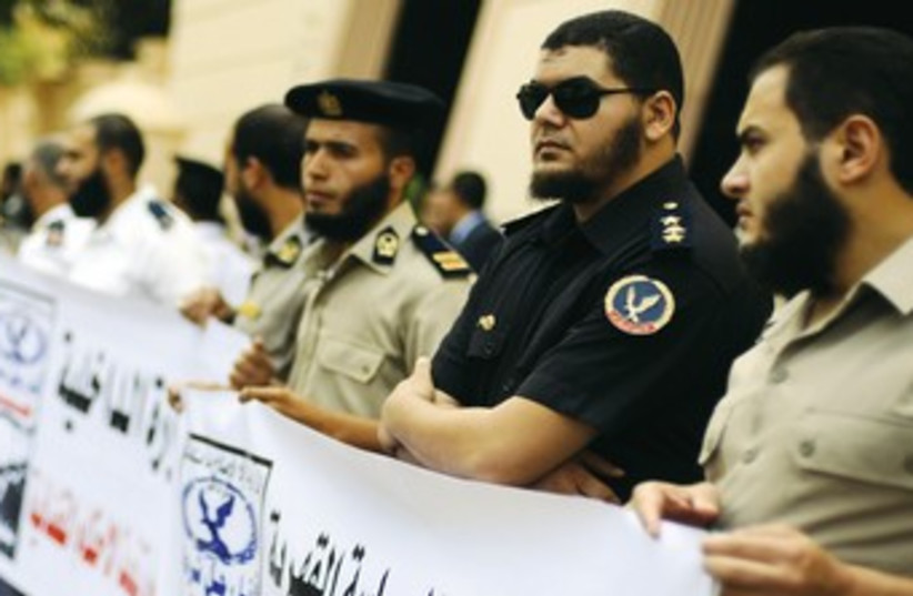 Egyptian police officers protesting over beards 370 (photo credit: Mohamed Abd El Ghany/Reuters)
