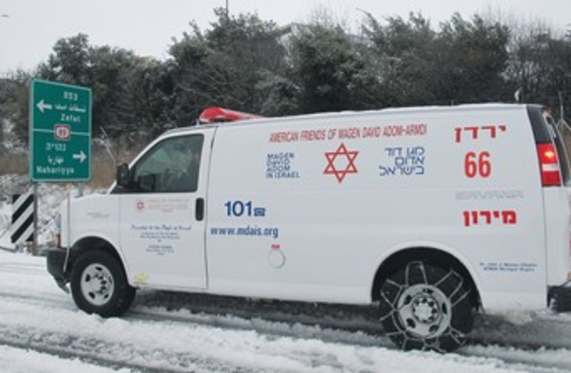 Ambulance drives through slush-covered streets of Safed 370 (photo credit: Courtesy Magen David Adom)