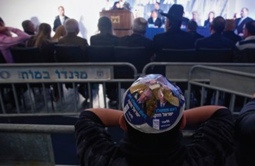 Boy with Netanyahu kipa 370 (photo credit: REUTERS)