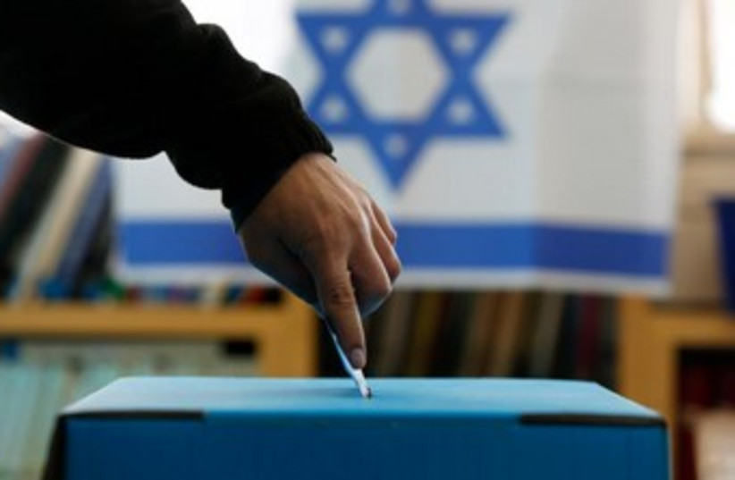Voters places ballot in box 370 (photo credit: REUTERS)