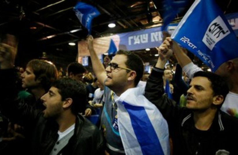Likud supporters celebrate at HQ after polls close 370 (photo credit: REUTERS)
