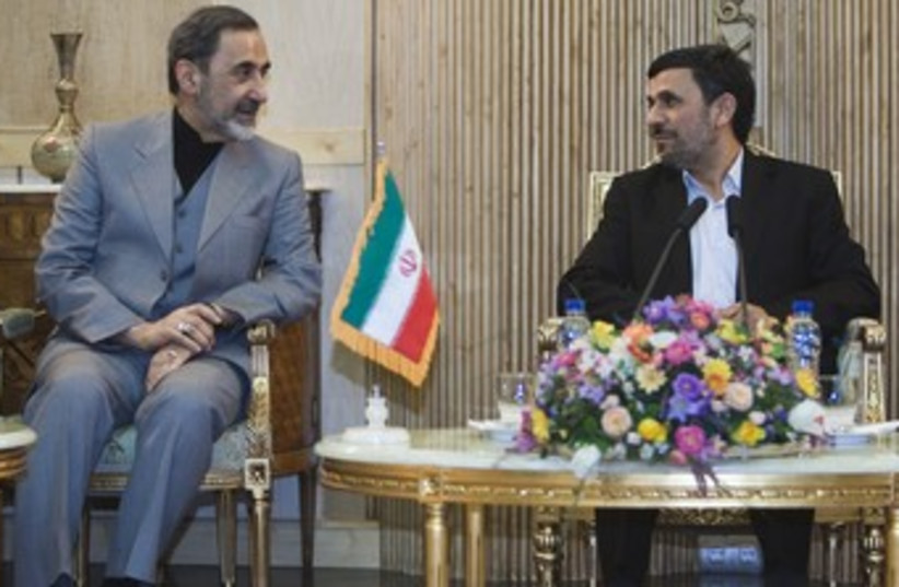 Ali Akbar Velayati with Mahmoud Ahmadinejad 370 (photo credit: REUTERS/Raheb Homavandi)