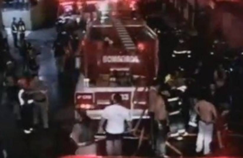 Fire engine at the scene of the nightclub fire in Brazil 370 (photo credit: YouTube Screenshot)