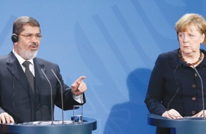 Morsi and Merkel and press conference in Berlin 370 (photo credit: Tobias Schwarz/Reuters)