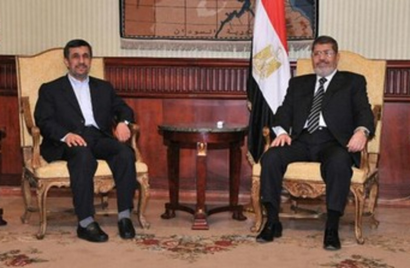 Ahmadinejad with Morsi in Cairo 370 (photo credit: REUTERS/Egyptian Presidency/Handout)