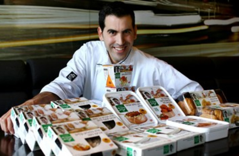 Chef Segev Moshe with his new range of meals 370  (photo credit: Courtesy PR)