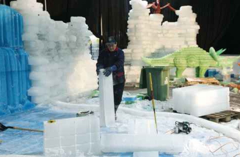 Man works on Ice City 521 (photo credit: MARC ISRAEL SELLEM)