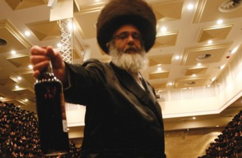 Religious men drink on Purim 370 (photo credit: REUTERS)