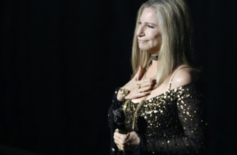 Barbra Streisand accepts  applause after performing 'Memories'