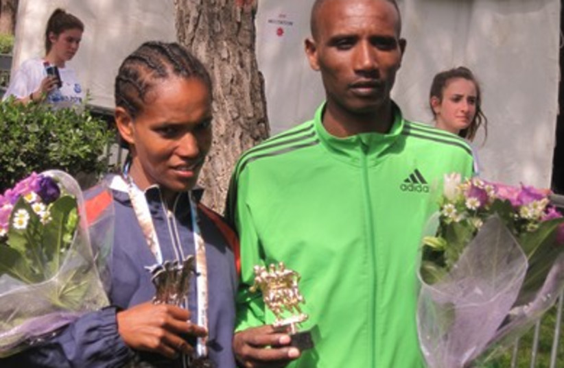 Male and female winners of the Jerusalem marathon 390