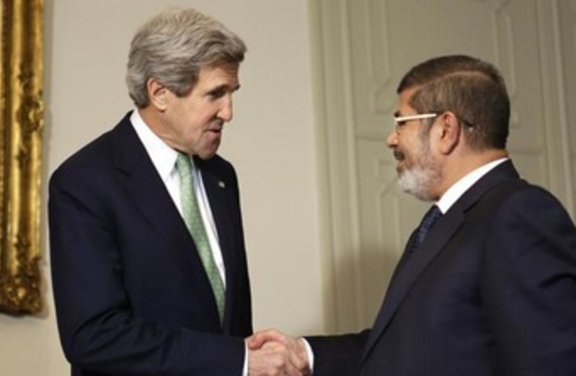 Kerry and Morsi 370 (photo credit: REUTERS)