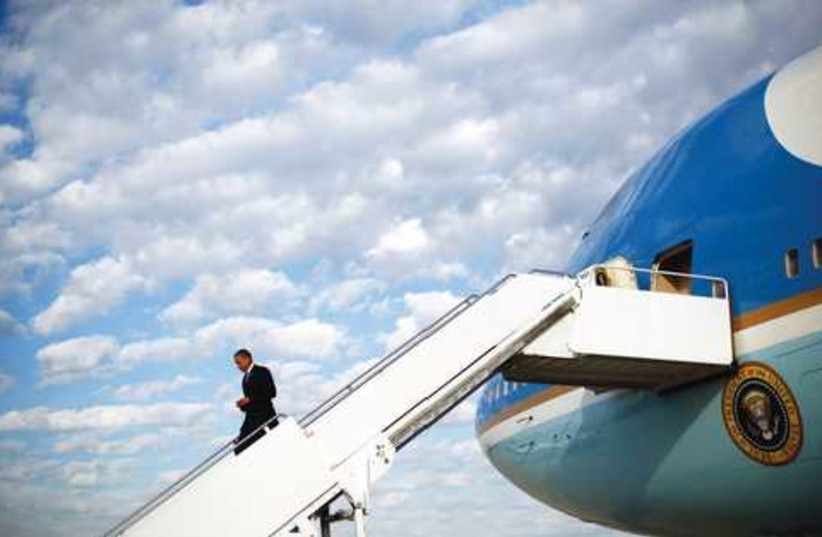 Obama and Airforce One 521 (photo credit: JASON REED / REUTERS)