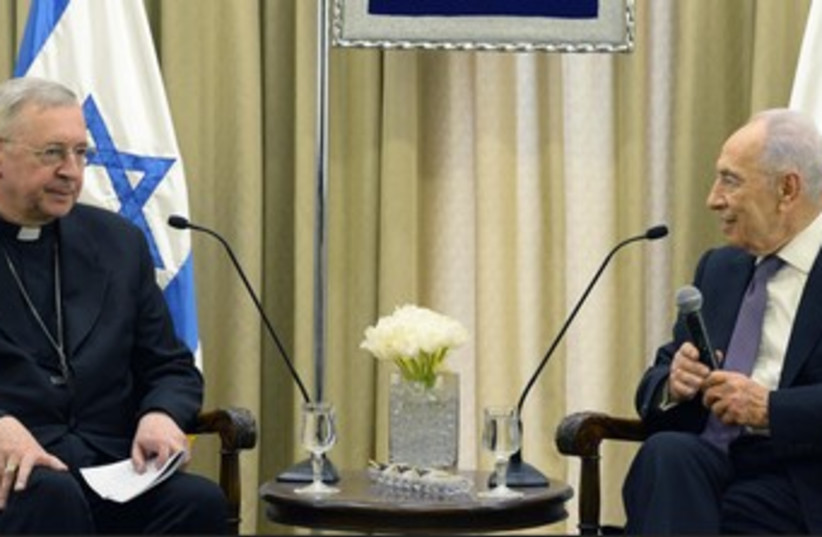 Peres and Bishop Gadecki 370 (photo credit: Courtesy Office of the President)