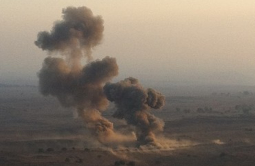 Blast caused by 300 kilograms of explosives sends debris 370 (photo credit: IDF Spokesman)