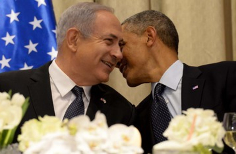 Obama whispers to Netanyahu 390 (photo credit: Avi Ohayon/GPO)