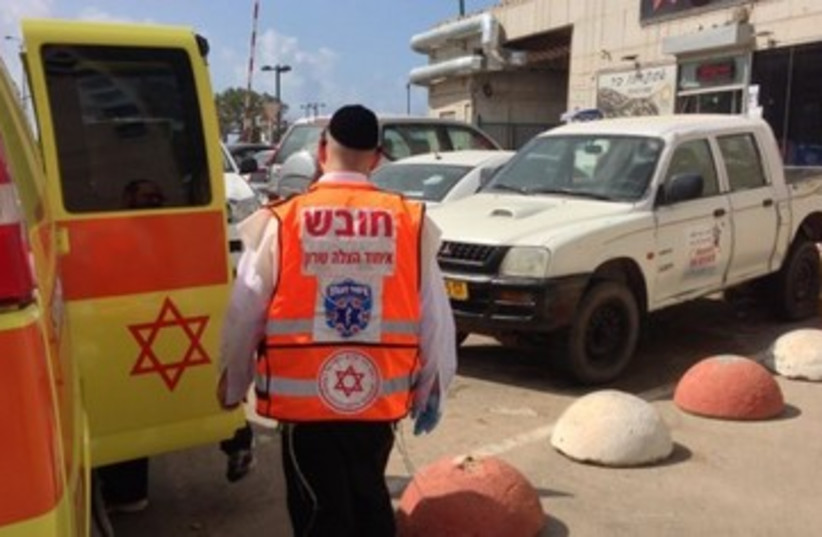 Ambulance at site of woman's death in Netanya 370 (photo credit: A. Yaakov/News 24 )