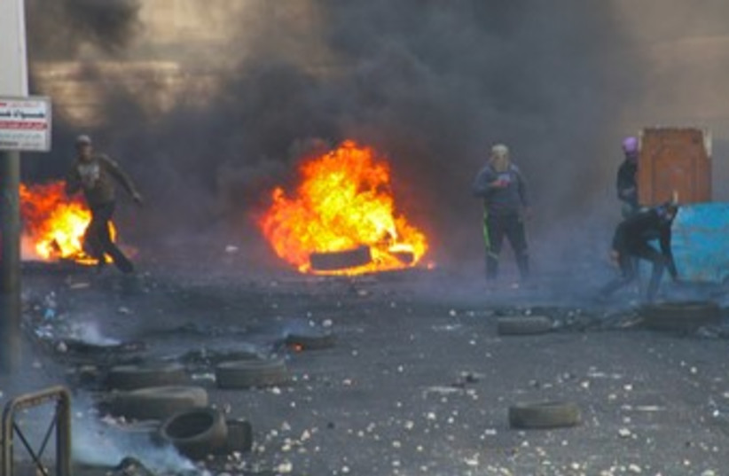 Palestinian rioters in Hebron 370 (photo credit: TOVAH LAZAROFF)