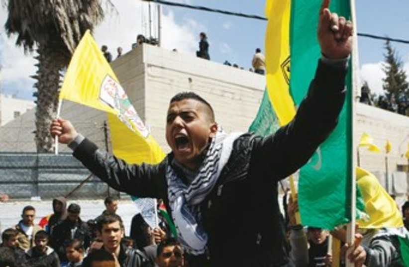 Fatah supporter Hebron 370 (photo credit: Mussa Qawasma/Reuters)