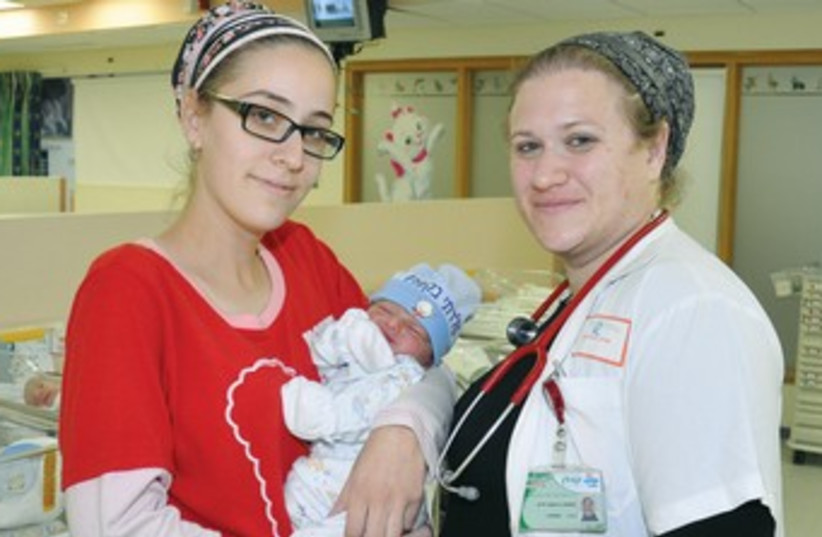 Doctor mother and baby 370 (photo credit: Courtesy Kaplan Medical Center)