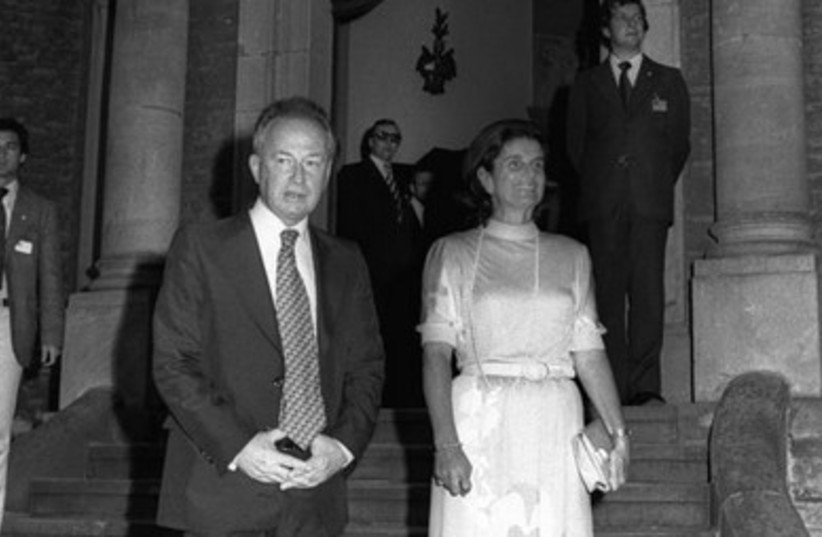 Yitzchak Rabin and wife Leah at a dinner party.