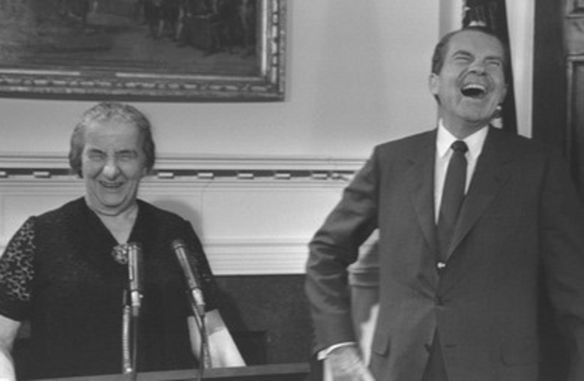 Golda Meir shares a laugh with former US President Nixon