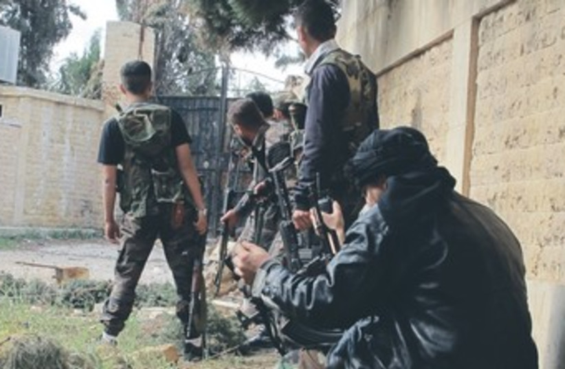 Syrian rebels 370 (photo credit: Abdalghne Karoof/Reuters)
