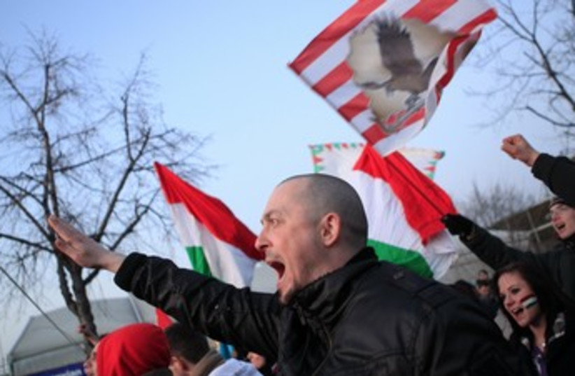 Far right Hungarian soccer supporters shout slogans 370 (photo credit: REUTERS/Bernadett Szabo)